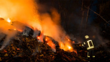 Pictured: A firefighter attending to wildfires in Greece. The IPCC's report outlines how increasing global temperatures and changing weather patterns contribute to extreme weather events.
